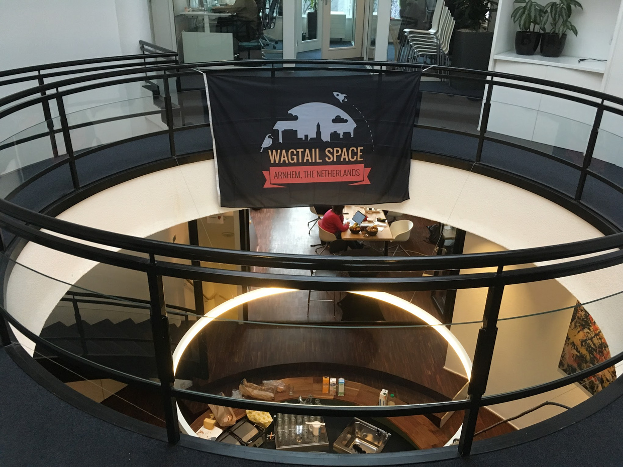 Photo of the Wagtail Space Arnhem venue, with the event's banner