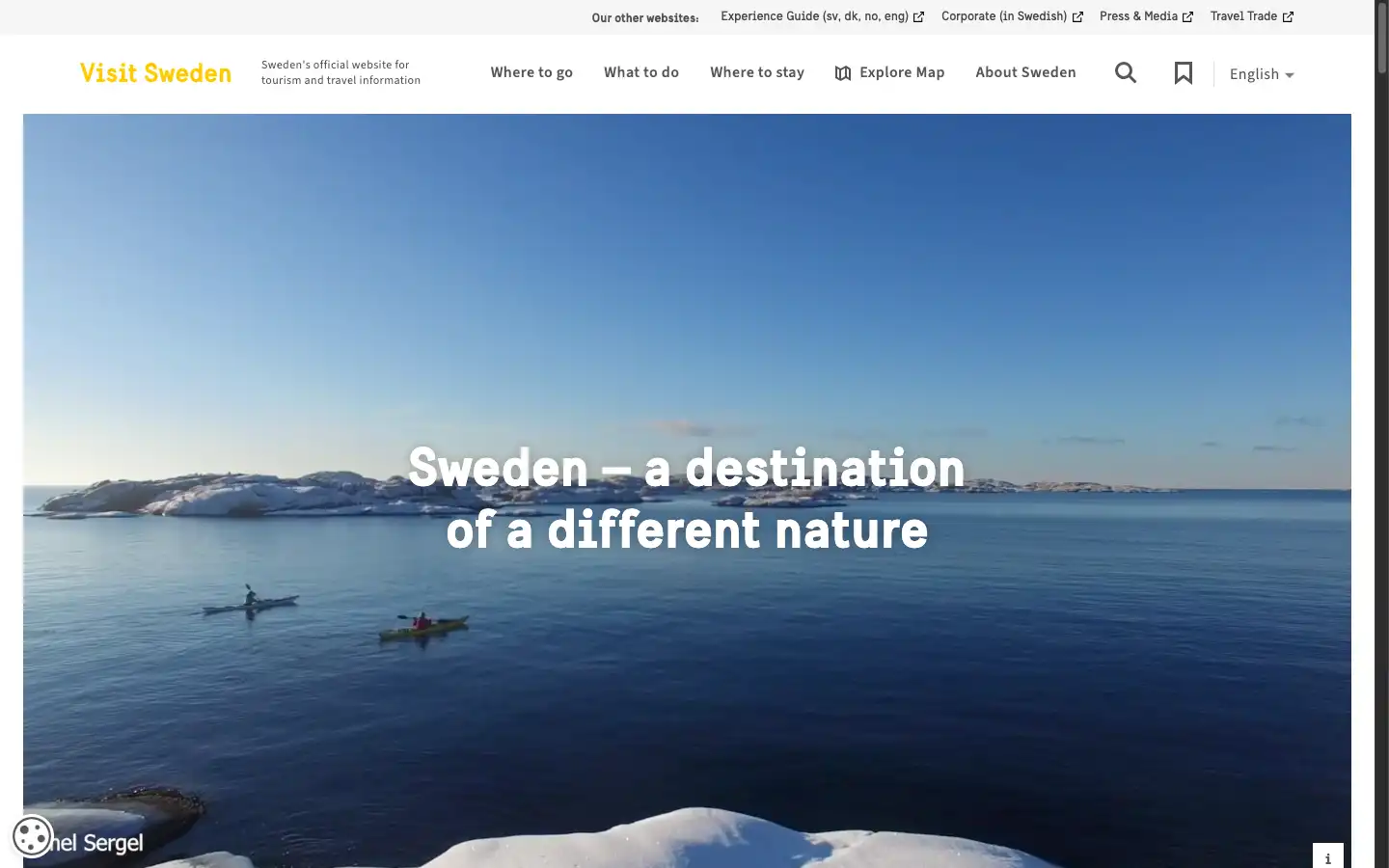 Screenshot of Visit Sweden website, with a yellow and white theme. The site states 'Sweden - A destination of a different nature' with a wide picture of sea kayaking