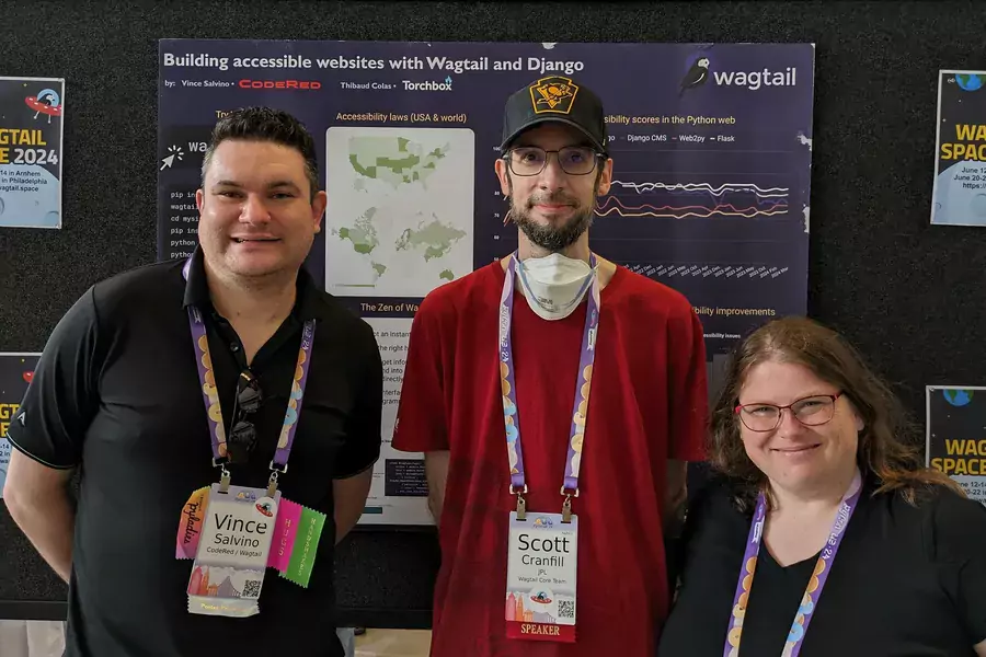 Vince, Scott, and Meagen in front of the poster at the conference