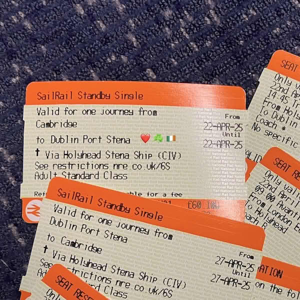 Close-up photo of UK SailRail train tickets, including one from Cambridge to Dublin via a Holyhead Stena Ship ferry crossing